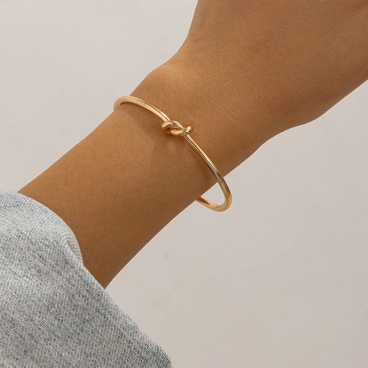 SIMPLE DOUBLE-LAYER HOLLOW KNOTTED OPEN BRACELET_CWMM3101